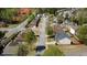 Aerial view of a quiet residential street lined with well-maintained homes and green trees at 2688 Autumn Ridge Ln, Lawrenceville, GA 30044