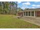 Spacious backyard with patio area ideal for entertaining, surrounded by lush greenery at 3441 Palace Ct, Tucker, GA 30084