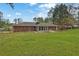 Large backyard with patio, mature trees, and ample green space, great for outdoor living at 3441 Palace Ct, Tucker, GA 30084