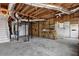 Unfinished basement with exposed ceiling and ductwork, offering potential for customization at 3441 Palace Ct, Tucker, GA 30084