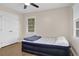 Bedroom with hardwood floors, a ceiling fan, and a double-door closet for storage at 3441 Palace Ct, Tucker, GA 30084
