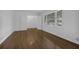 Bright bedroom features wood floors, double door closet, and large window with blinds at 3441 Palace Ct, Tucker, GA 30084