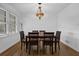Traditional dining room with wood floors, crown moulding and a unique stained glass chandelier at 3441 Palace Ct, Tucker, GA 30084