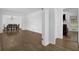Hallway view leading to a dining area and living room with hardwood floors and white trim at 3441 Palace Ct, Tucker, GA 30084