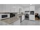 Kitchen features white cabinets, granite countertops and stainless steel appliances at 3441 Palace Ct, Tucker, GA 30084