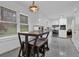 Bright kitchen features a breakfast bar with stool seating and stainless steel appliances at 3441 Palace Ct, Tucker, GA 30084