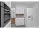 Kitchen features white cabinets, granite countertops and stainless steel appliances at 3441 Palace Ct, Tucker, GA 30084