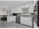 Kitchen features white cabinets, granite countertops and stainless steel appliances at 3441 Palace Ct, Tucker, GA 30084