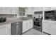 Kitchen features white cabinets, granite countertops and stainless steel appliances at 3441 Palace Ct, Tucker, GA 30084