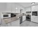 Kitchen features white cabinets, granite countertops and stainless steel appliances at 3441 Palace Ct, Tucker, GA 30084