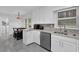 Kitchen features white cabinets, granite countertops and stainless steel appliances at 3441 Palace Ct, Tucker, GA 30084