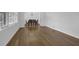 Sunlit living room features hardwood floors, large windows, and a dining area in view at 3441 Palace Ct, Tucker, GA 30084