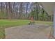 Back patio with seating and views of the lush, private backyard and storage shed at 3441 Palace Ct, Tucker, GA 30084