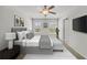 Serene bedroom with neutral tones, a comfortable bed, and ample natural light from the windows at 7083 Gladstone Cir, Stonecrest, GA 30038