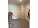 Unorganized walk-in closet, offering ample storage space with shelving, still in original packaging at 7083 Gladstone Cir, Stonecrest, GA 30038