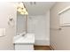 Clean bathroom features a vanity, mirror, shower over tub, and good lighting at 1679 Sw Lisbon Sw Dr, Atlanta, GA 30310