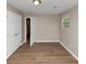 A bright, neutral bedroom with laminate flooring and large windows at 1679 Sw Lisbon Sw Dr, Atlanta, GA 30310