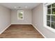 This room showcases sleek flooring, neutral walls, with natural light streaming through the windows at 1679 Sw Lisbon Sw Dr, Atlanta, GA 30310