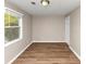 This empty bedroom features wood-look flooring and neutral paint, ready for personalization at 1679 Sw Lisbon Sw Dr, Atlanta, GA 30310