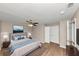 Stylishly decorated bedroom features wood-look floors and a ceiling fan at 1679 Sw Lisbon Sw Dr, Atlanta, GA 30310