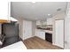 Well-lit kitchen showcasing white cabinets, neutral paint, laminate countertops, and stainless steel appliances at 1679 Sw Lisbon Sw Dr, Atlanta, GA 30310