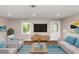 Cozy living room featuring stylish furnishings, warm lighting, and hardwood flooring at 1679 Sw Lisbon Sw Dr, Atlanta, GA 30310