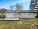 Back of house featuring a wooden deck and backyard at 1886 Hazelwood Se Dr, Marietta, GA 30067