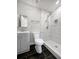 Modern bathroom with tiled walk-in shower, vanity, and stylish fixtures at 1886 Hazelwood Se Dr, Marietta, GA 30067