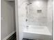 Modern bathroom featuring bathtub with marble-look tile at 1886 Hazelwood Se Dr, Marietta, GA 30067