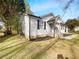 Charming single-story home featuring white siding, black shutters, and a landscaped yard at 1886 Hazelwood Se Dr, Marietta, GA 30067