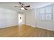 Bright bedroom showcases wood-style flooring, a ceiling fan, and a window with shutter-style coverings at 2965 Pharr Court South Nw # 503, Atlanta, GA 30305