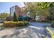 Brick condominium building with covered front entrance, mature landscape, and surface parking at 2965 Pharr Court South Nw # 503, Atlanta, GA 30305