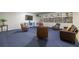 Inviting common room with cozy seating, a large bookshelf, and a TV for relaxation and entertainment at 2965 Pharr Court South Nw # 503, Atlanta, GA 30305
