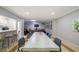 Spacious dining area with kitchen view, a long table with chairs, and connecting to a common room at 2965 Pharr Court South Nw # 503, Atlanta, GA 30305