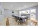 Large dining room featuring a long table, a stylish light fixture, and views into the kitchen at 2965 Pharr Court South Nw # 503, Atlanta, GA 30305