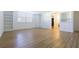 Bright living room with built-in bookshelves and a view into the bathroom at 2965 Pharr Court South Nw # 503, Atlanta, GA 30305