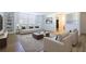 Bright living room with built-in bookshelves, neutral furniture, and a decorative area rug at 2965 Pharr Court South Nw # 503, Atlanta, GA 30305