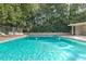 Inviting pool area offers ample seating, a cabana, and lush greenery for a resort-style living experience at 2965 Pharr Court South Nw # 503, Atlanta, GA 30305