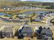Stunning aerial view of the community showcasing homes, amenities, a pond, and green spaces in a picturesque setting at 3515 Montebello Pkwy, Cumming, GA 30028
