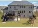 Backyard view with stairs, deck, patio, and play set at 3515 Montebello Pkwy, Cumming, GA 30028