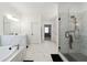Modern bathroom with marble tile, glass shower, soaking tub, and double vanity at 3515 Montebello Pkwy, Cumming, GA 30028