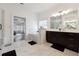 Elegant bathroom with marble floors, glass shower, soaking tub, and large double vanity at 3515 Montebello Pkwy, Cumming, GA 30028