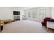 Bright bonus room with carpet flooring, large windows and entertainment center at 3515 Montebello Pkwy, Cumming, GA 30028
