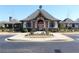 Beautiful community center featuring elegant architecture, manicured landscaping, and inviting entrance ways at 3515 Montebello Pkwy, Cumming, GA 30028