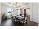 Elegant dining room with coffered ceiling, large windows, and stylish chandelier at 3515 Montebello Pkwy, Cumming, GA 30028