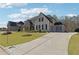 Stately two-story home boasts meticulous landscaping, a charming walkway, and a three-car garage at 3515 Montebello Pkwy, Cumming, GA 30028