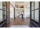 Grand foyer with high ceilings, hardwood floors, barn doors, and wrought iron staircase at 3515 Montebello Pkwy, Cumming, GA 30028