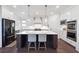 Modern kitchen with an island, stainless steel appliances, and white cabinets at 3515 Montebello Pkwy, Cumming, GA 30028