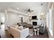 Bright living room featuring a fireplace, built-in bookshelves, and comfortable seating arrangement at 3515 Montebello Pkwy, Cumming, GA 30028