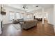 Spacious living room with hardwood floors, large windows, and open floor plan at 3515 Montebello Pkwy, Cumming, GA 30028